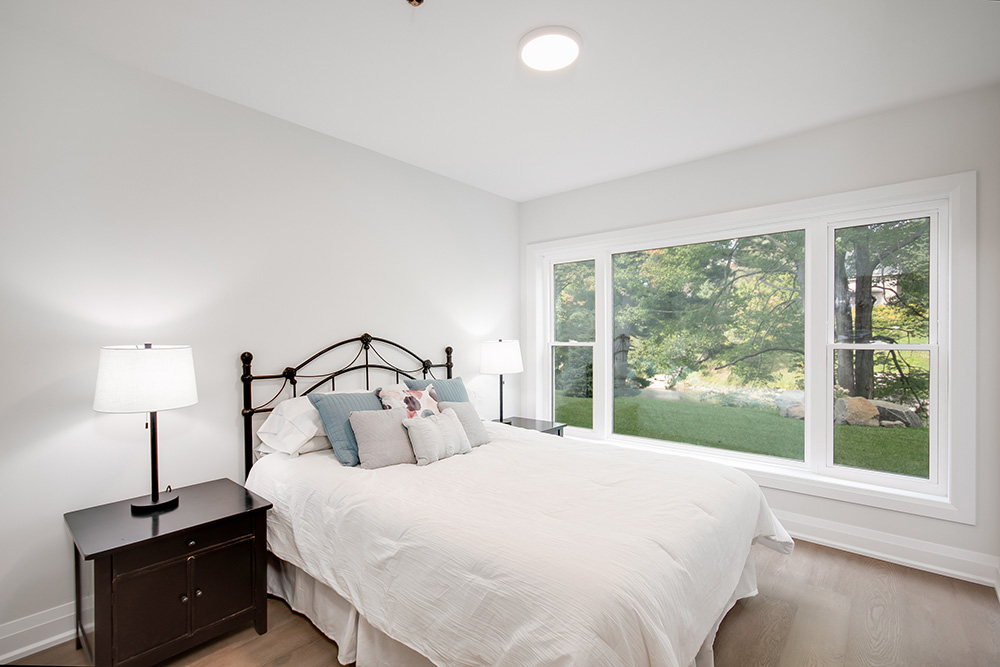 River’s Edge Bracebridge condos landscaped patio with stairs down to dock